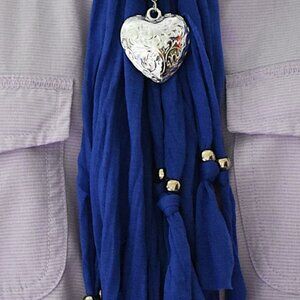 Royal blue one size scarf with a sliver heart pendant. along with bead accents